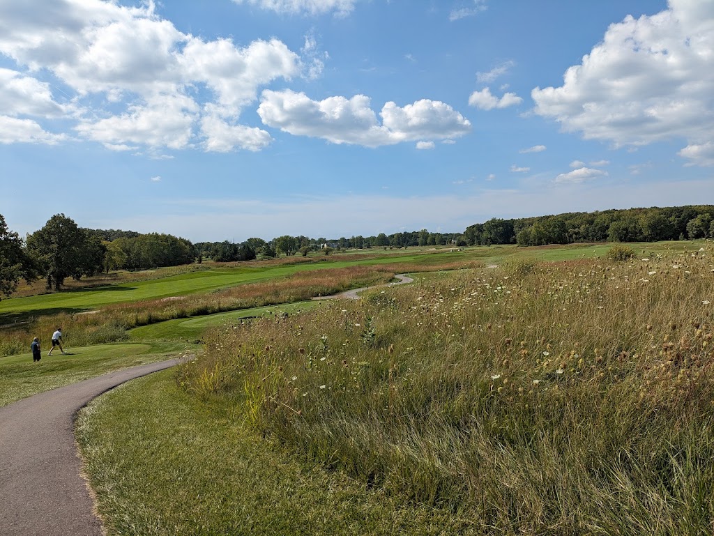 Panoramic view of a lush green golf course at Meadows Club House (MCH). Smooth