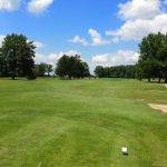 Panoramic view of a lush green golf course at Memorial Park Golf Course. Smooth