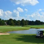 Panoramic view of a lush green golf course at Memphis National Golf Club. Smooth