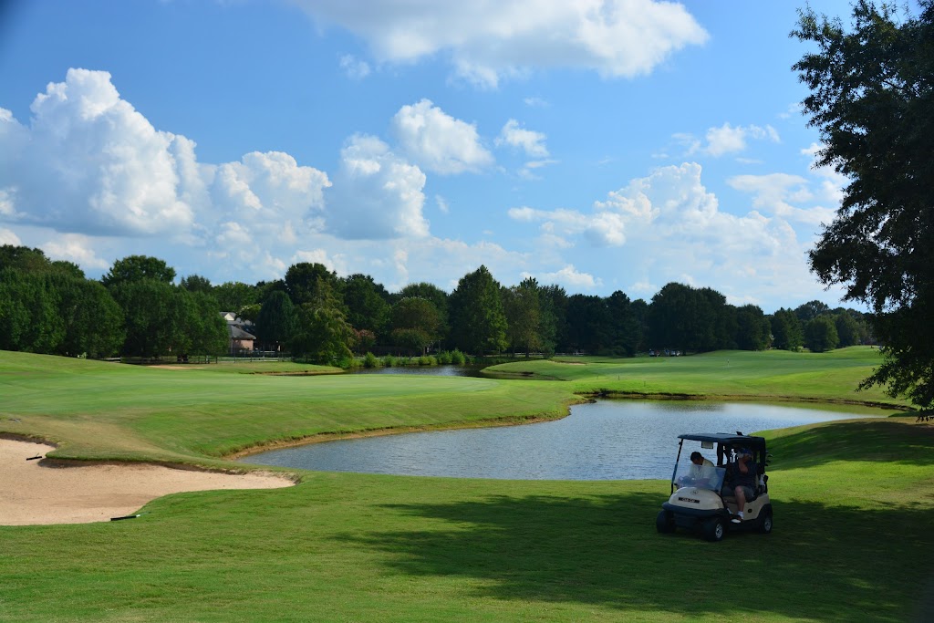 Panoramic view of a lush green golf course at Memphis National Golf Club. Smooth