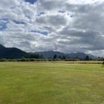 Panoramic view of a lush green golf course at Mendenhall Golf. Smooth