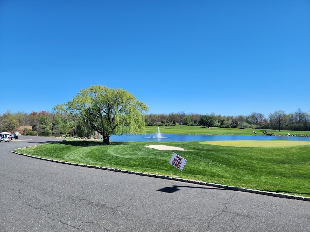 Panoramic view of a lush green golf course at Mercer Oaks Golf Course. Smooth