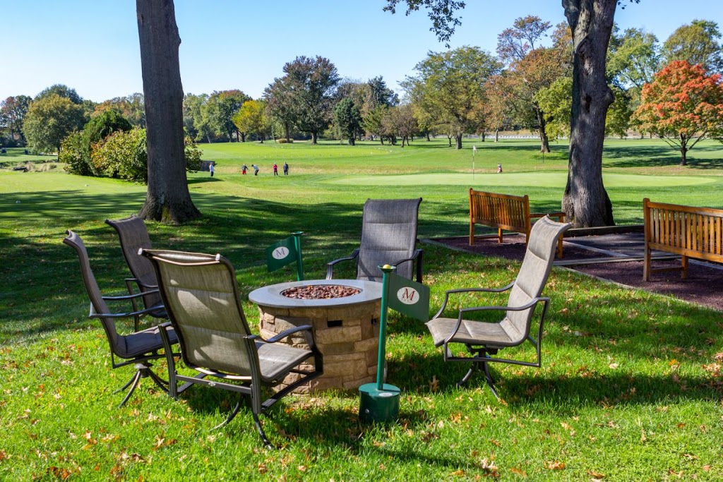 Panoramic view of a lush green golf course at Merchantville Country Club. Smooth