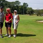 Panoramic view of a lush green golf course at Mere Creek Golf Course. Smooth
