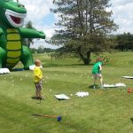 Panoramic view of a lush green golf course at Meridian Sun Golf Club. Smooth