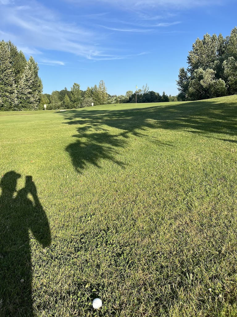 Panoramic view of a lush green golf course at Meriwether National Golf Club. Smooth