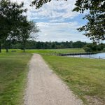 Panoramic view of a lush green golf course at Merrick Golf Course. Smooth