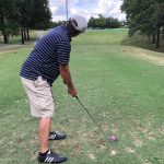green grass with the flag in the hole.
