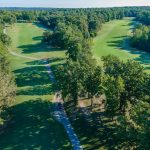 Panoramic view of a lush green golf course at Metfield Golf Complex (Dogwood/Brittany). Smooth