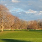 Panoramic view of a lush green golf course at Miami Shores Golf Course. Smooth