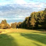Panoramic view of a lush green golf course at Michelbook Country Club. Smooth