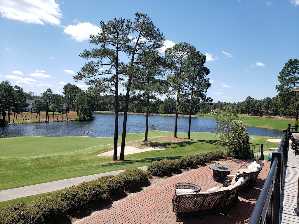 Panoramic view of a lush green golf course at Mid South Club. Smooth
