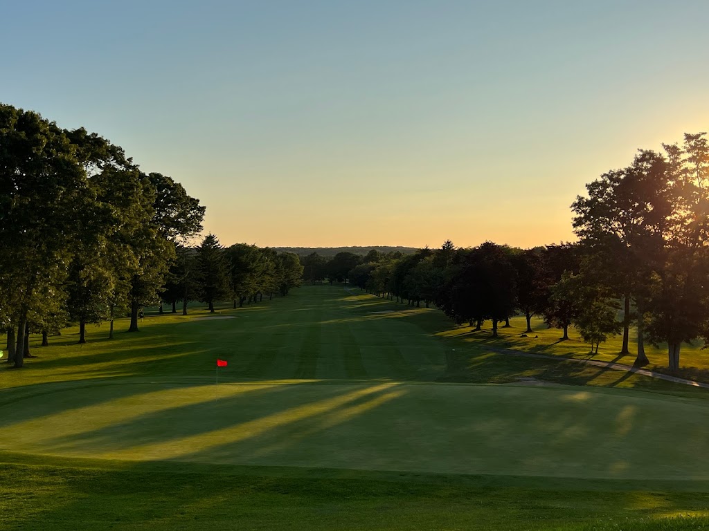 Panoramic view of a lush green golf course at Middle Island Country Club. Smooth