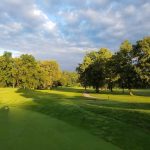 Panoramic view of a lush green golf course at Midland Trail Golf Club. Smooth