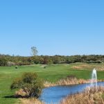 Panoramic view of a lush green golf course at Mill Pond Golf Course. Smooth