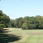 Panoramic view of a lush green golf course at Mill Quarter Plantation Golf Club. Smooth