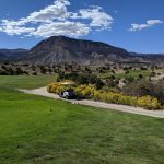 Panoramic view of a lush green golf course at Millsite Golf Course. Smooth