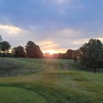 Panoramic view of a lush green golf course at Mines Golf Club. Smooth