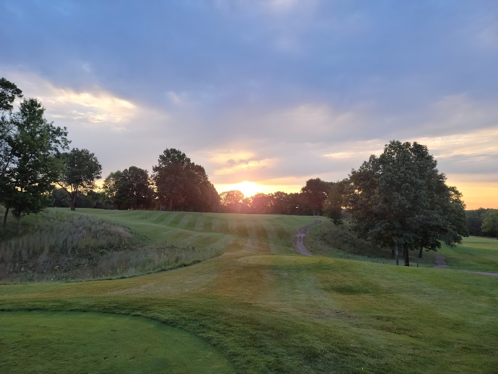 Panoramic view of a lush green golf course at Mines Golf Club. Smooth