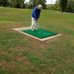 green grass with the flag in the hole.