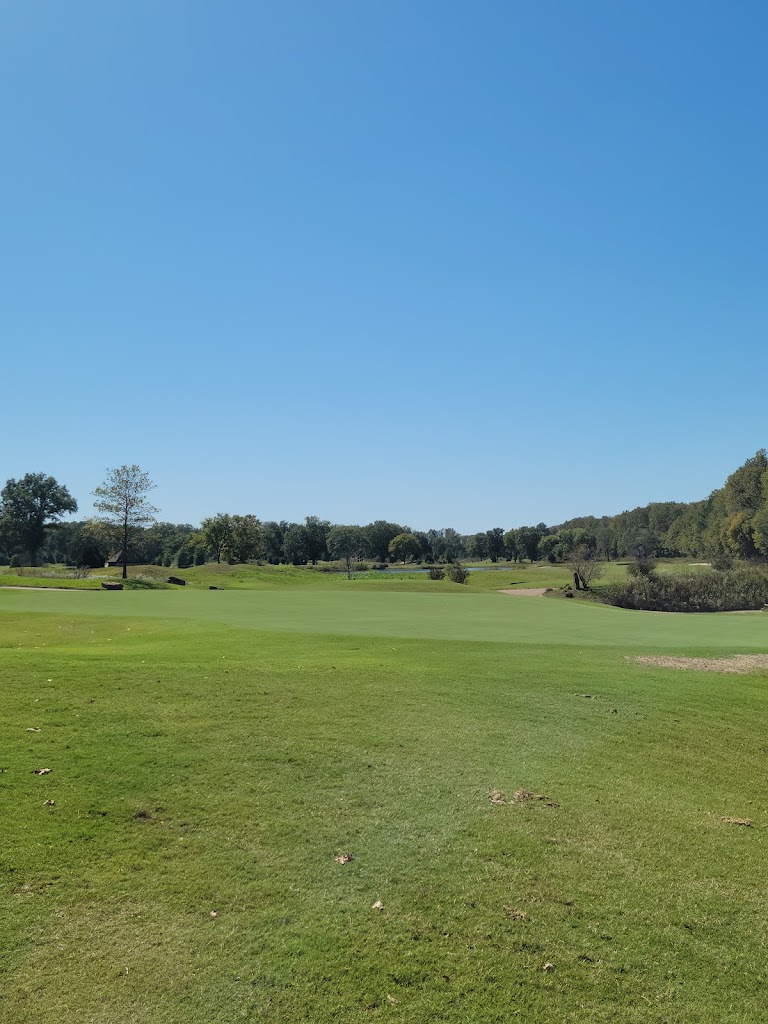 Panoramic view of a lush green golf course at Mirimichi Golf Course. Smooth