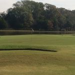 Panoramic view of a lush green golf course at Mississippi State University Golf Course. Smooth