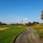 green grass with the flag in the hole.