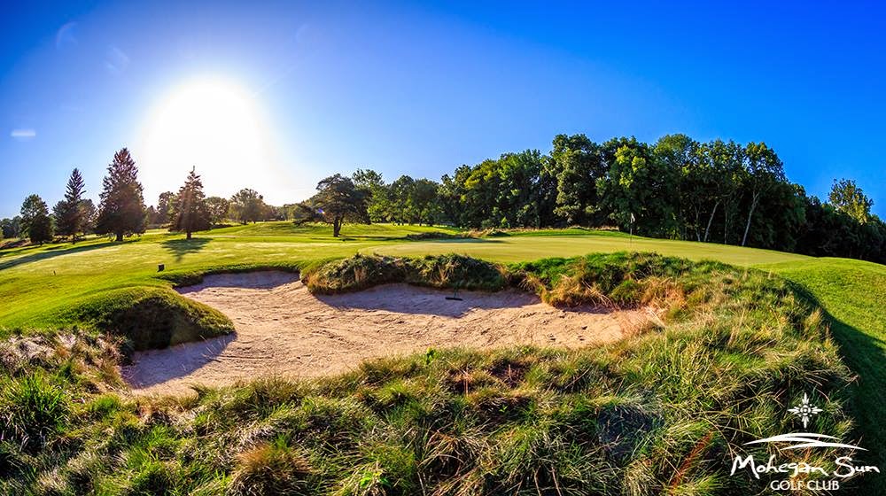 Panoramic view of a lush green golf course at Mohegan Sun Golf Club. Smooth