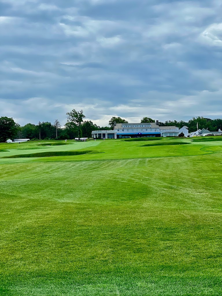Panoramic view of a lush green golf course at Montclair Golf Club. Smooth