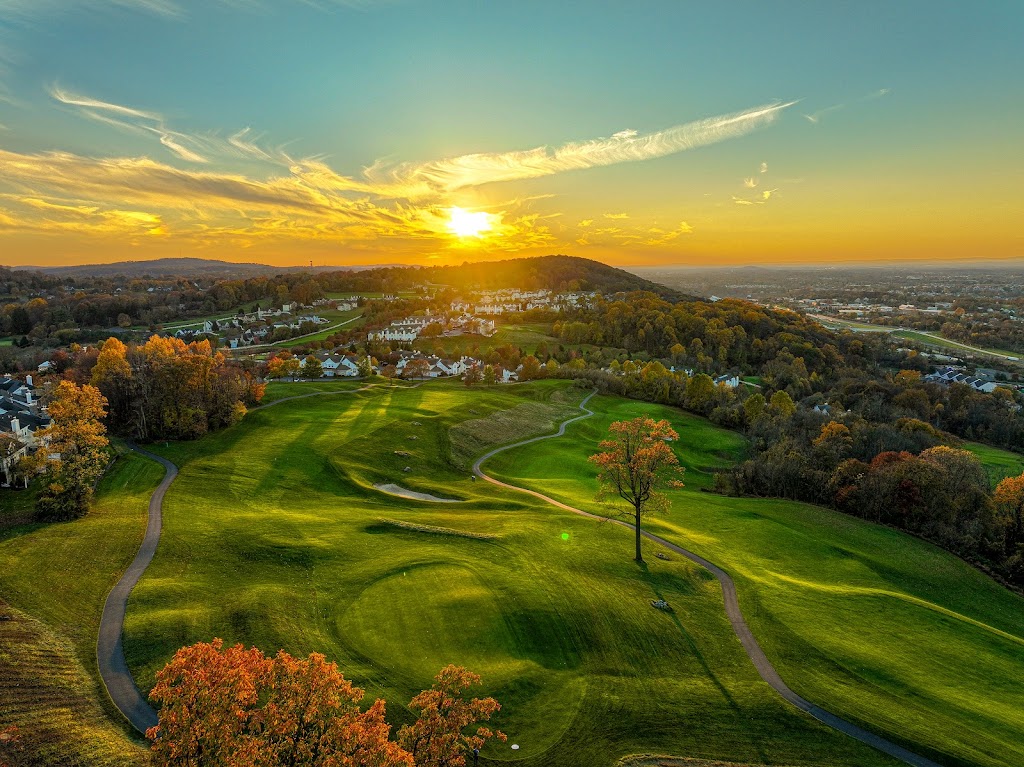 Panoramic view of a lush green golf course at Morgan Hill Golf Course. Smooth