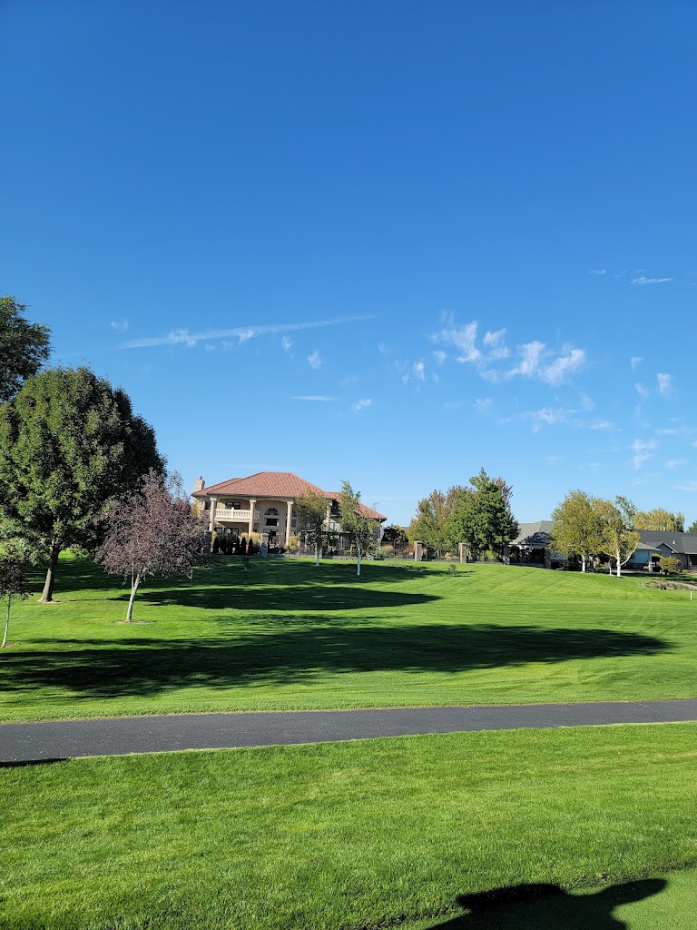 Panoramic view of a lush green golf course at Moses Lake Golf Club. Smooth