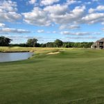 green grass with the flag in the hole.