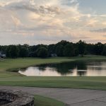 Panoramic view of a lush green golf course at Mossy Oak Golf Club. Smooth