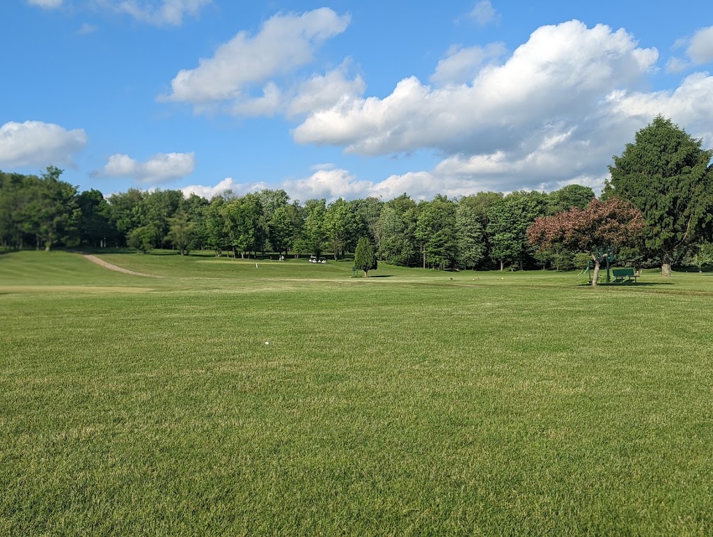 Panoramic view of a lush green golf course at Mound Grove Golf Course. Smooth