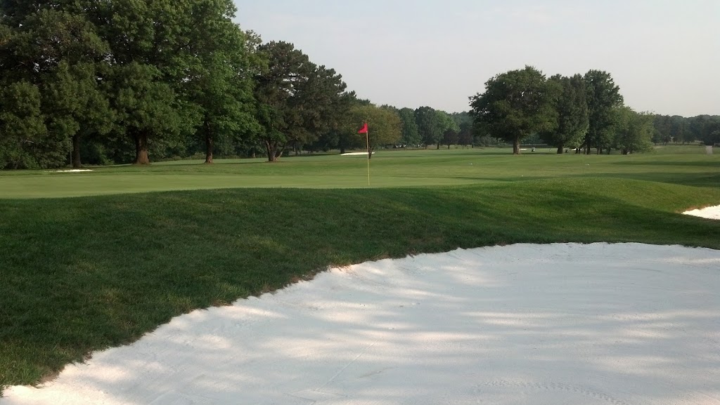 Panoramic view of a lush green golf course at Mount Pleasant Golf Course. Smooth