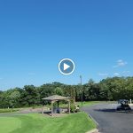 green grass with the flag in the hole.
