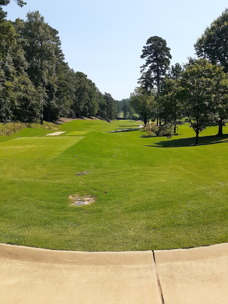 Panoramic view of a lush green golf course at Mountain Brook Club. Smooth
