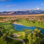 Panoramic view of a lush green golf course at Mountain Falls Golf Club. Smooth