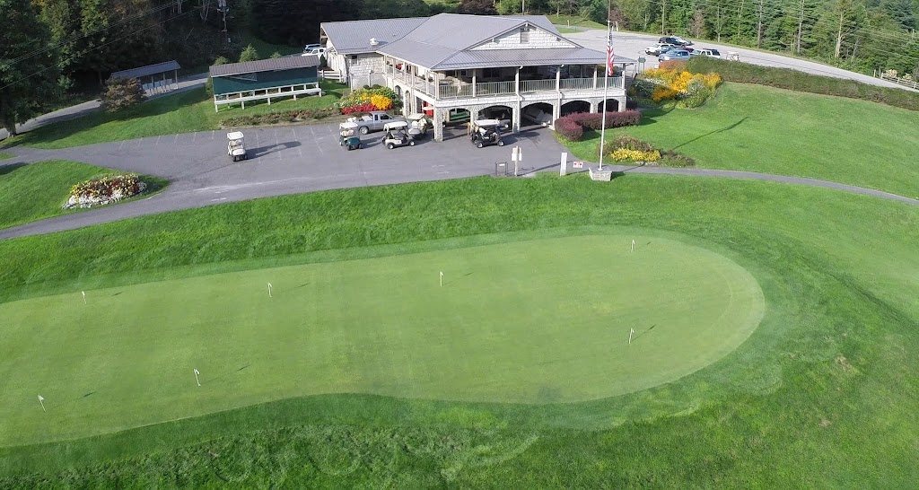 Panoramic view of a lush green golf course at Mountain Glen Golf Club. Smooth
