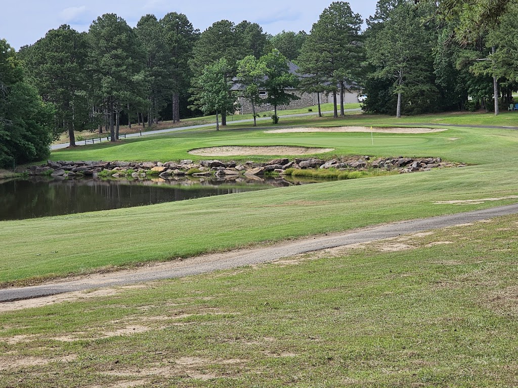 Panoramic view of a lush green golf course at Mountain Ranch Golf Club. Smooth