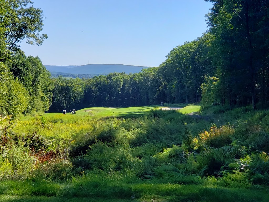 Panoramic view of a lush green golf course at Mountain Valley Golf Course. Smooth