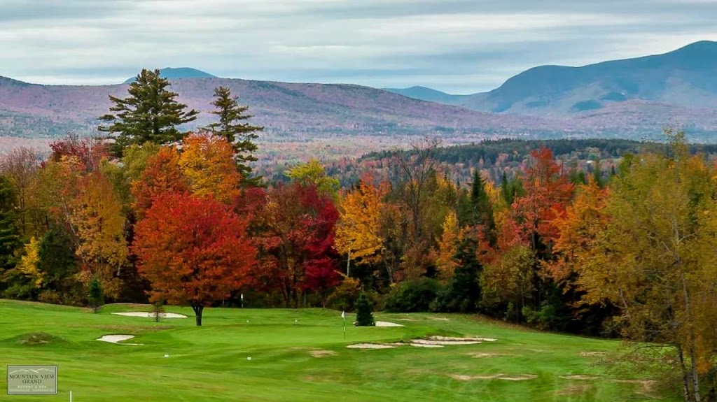 Panoramic view of a lush green golf course at Mountain View Grand Golf Course. Smooth