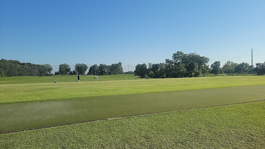 Panoramic view of a lush green golf course at Mules National Golf Club. Smooth