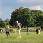 Panoramic view of a lush green golf course at Mulligan's Pointe. Smooth