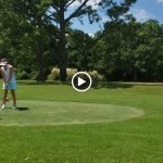 green grass with the flag in the hole.