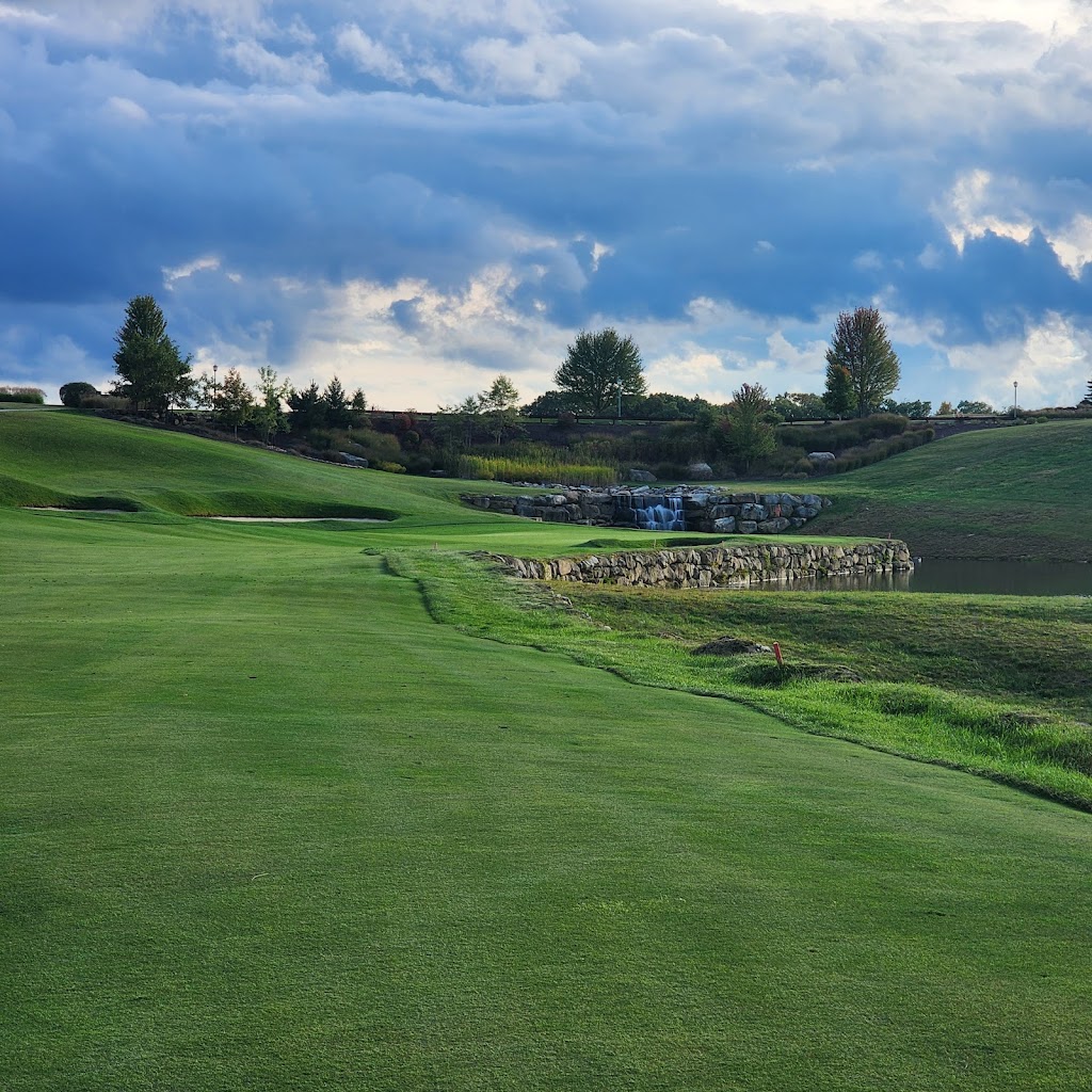 Panoramic view of a lush green golf course at Na. Smooth