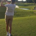 green grass with the flag in the hole.