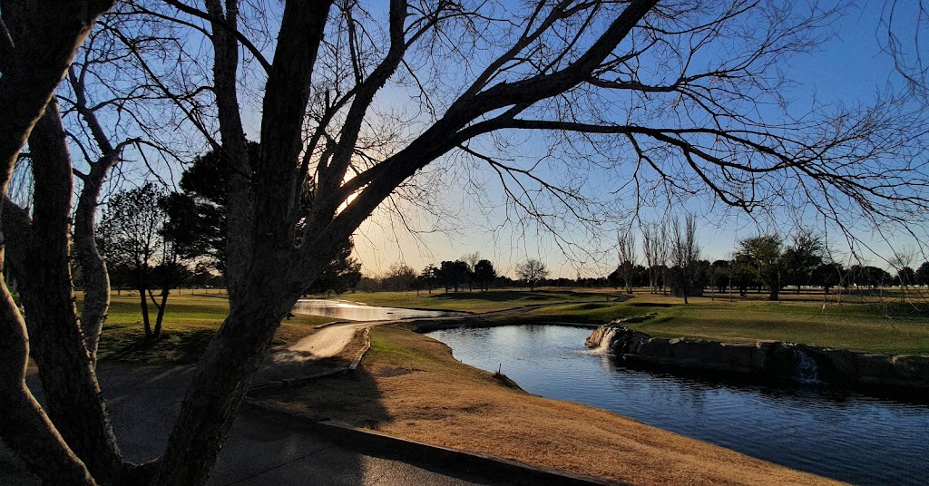 Panoramic view of a lush green golf course at Nancy Lopez Golf Course at Spring River. Smooth