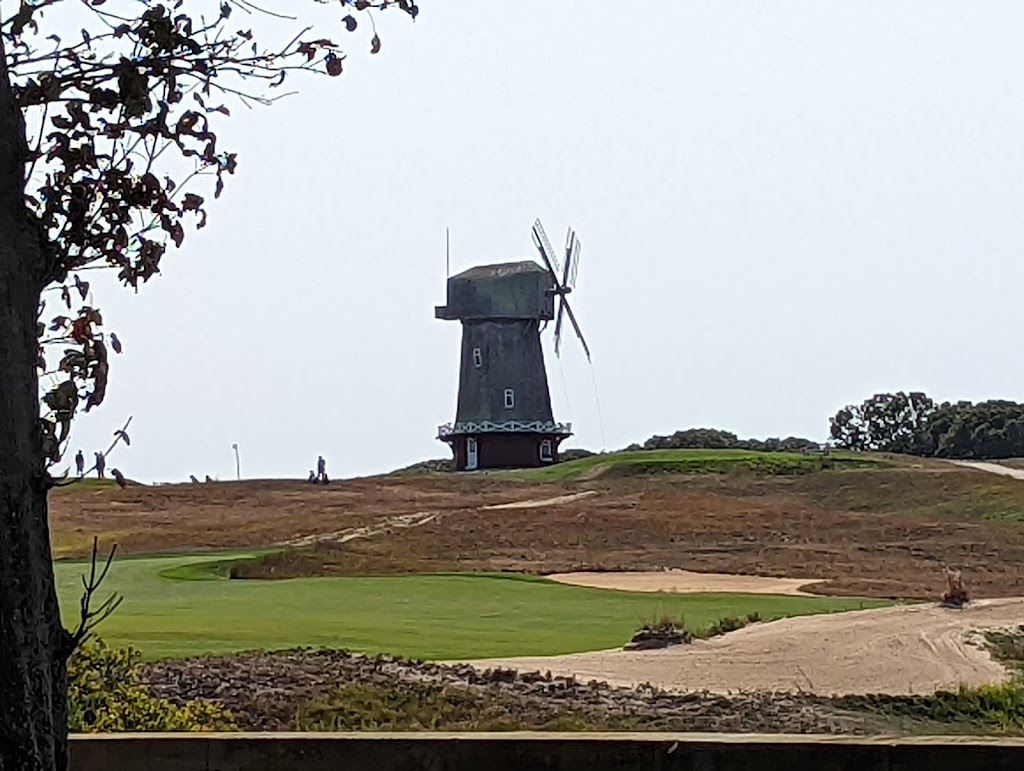 Panoramic view of a lush green golf course at National Golf Links Of America. Smooth