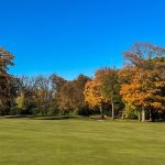 Panoramic view of a lush green golf course at New Berlin Hills Golf Course. Smooth